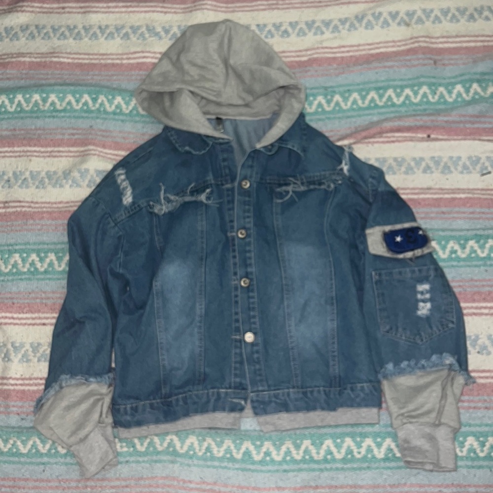 Distressed blue denim jacket